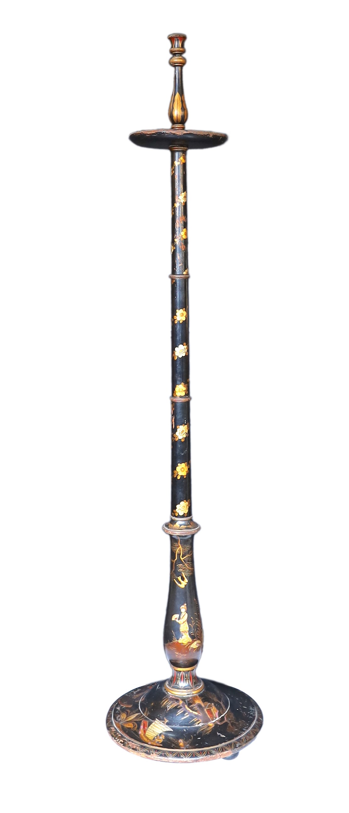 A 1920s English chinoiserie lacquered lamp standard, decorated with gilt figures in boats and flowers on a black ground, height 164cm. width of base 38cm